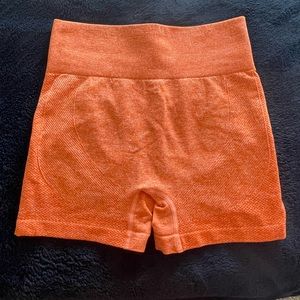 orange biker shorts